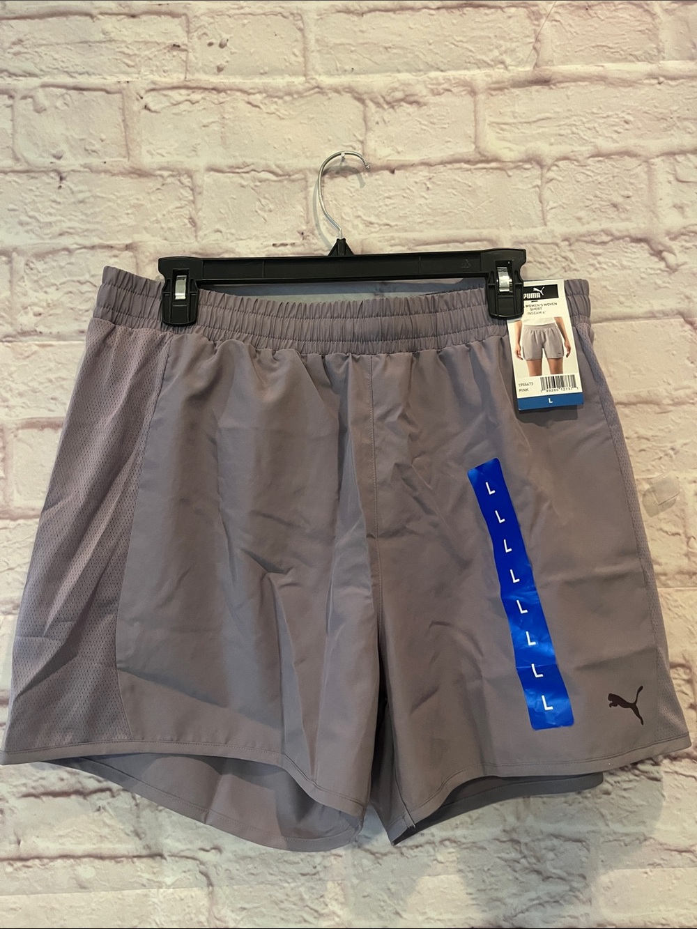 Puma Womans  Athletic Shorts in Light Purple with Black Logo